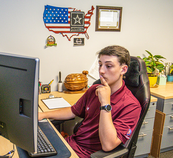 CCI Employee Working On Communication Network Solutions