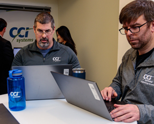 CCI Team working on a laptop